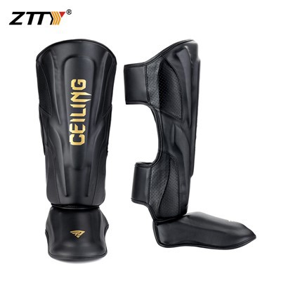 Svartur gull muay thai shin verðir